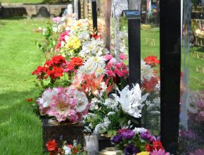memorial grave with flowers on
